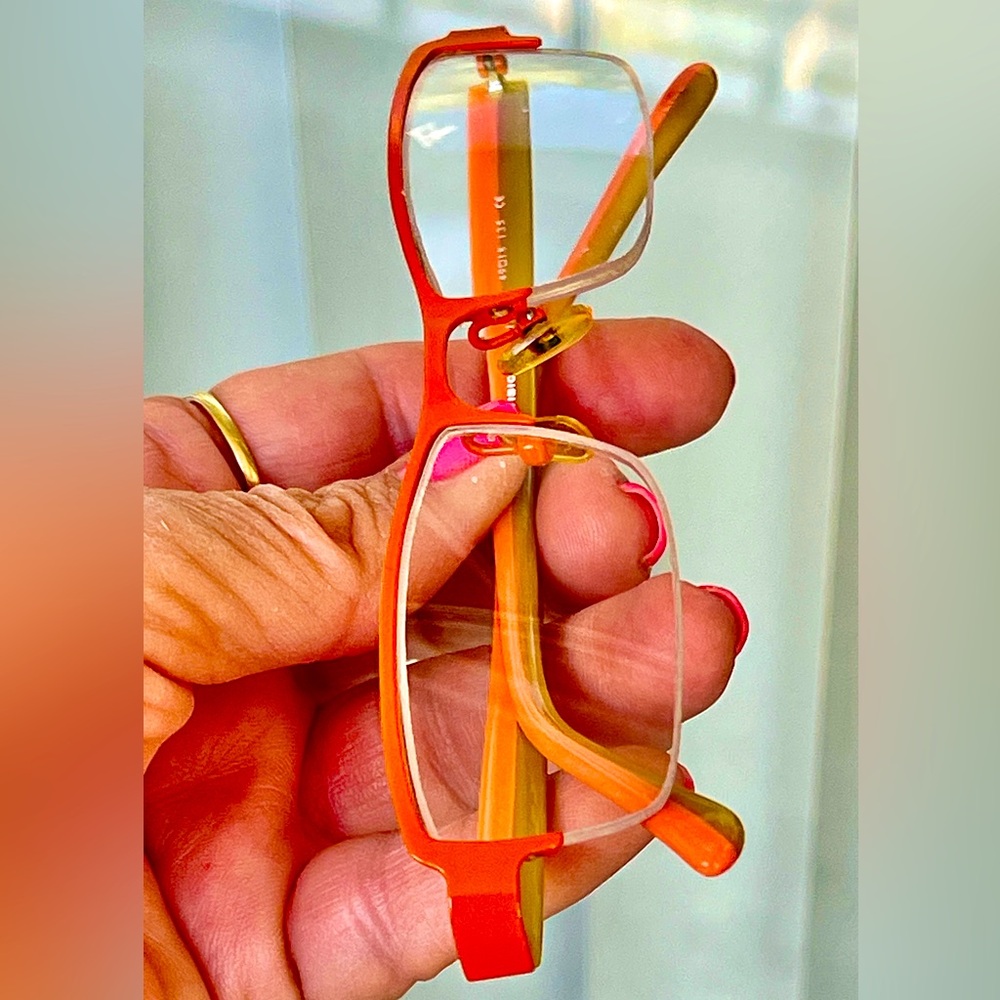 Vision’s Eye Glasses Orange 1/2 Wire frame bottom Rimless; bows orange& olive